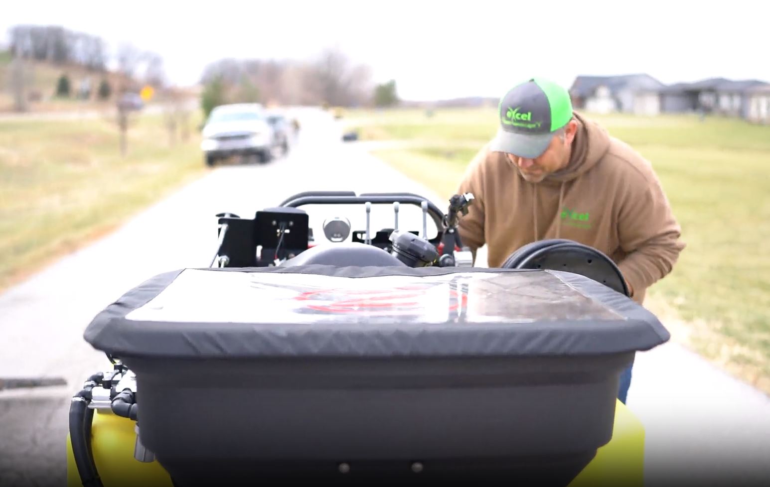 Weed Control | Excel Lawns & Landscape Des Moines, IA Weed control service experts pulling out weeds in the lawn